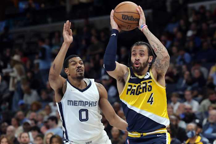Pacers Duane Washington Jr. drives on De'Anthony Melton